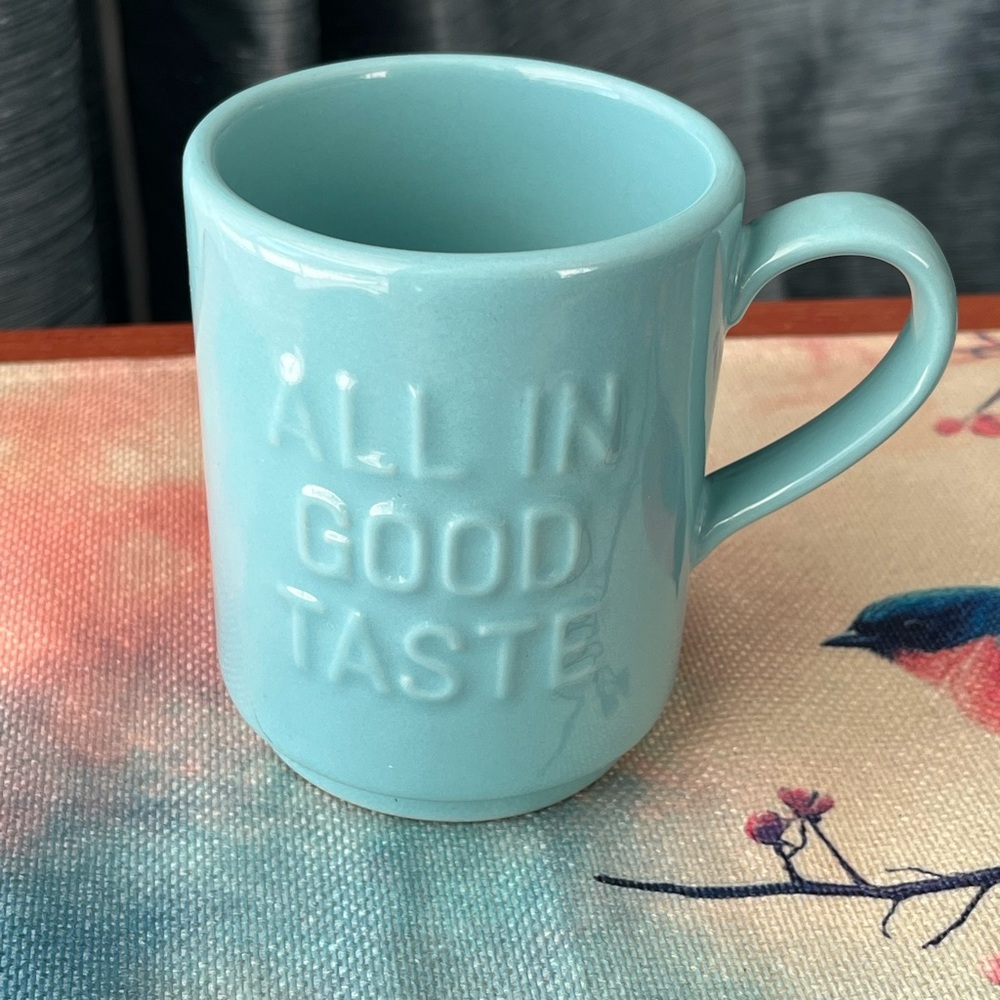 Kate Spade Light Teal Ceramic Mug With Embossed "ALL IN GOOD TASTE"